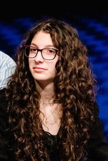 A portrait of Esra. Drag me — the text flows around wherever I land.